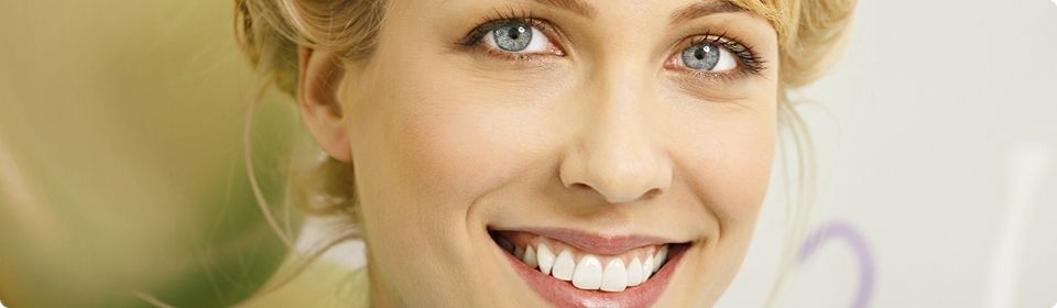 woman smiling with white, straight teeth